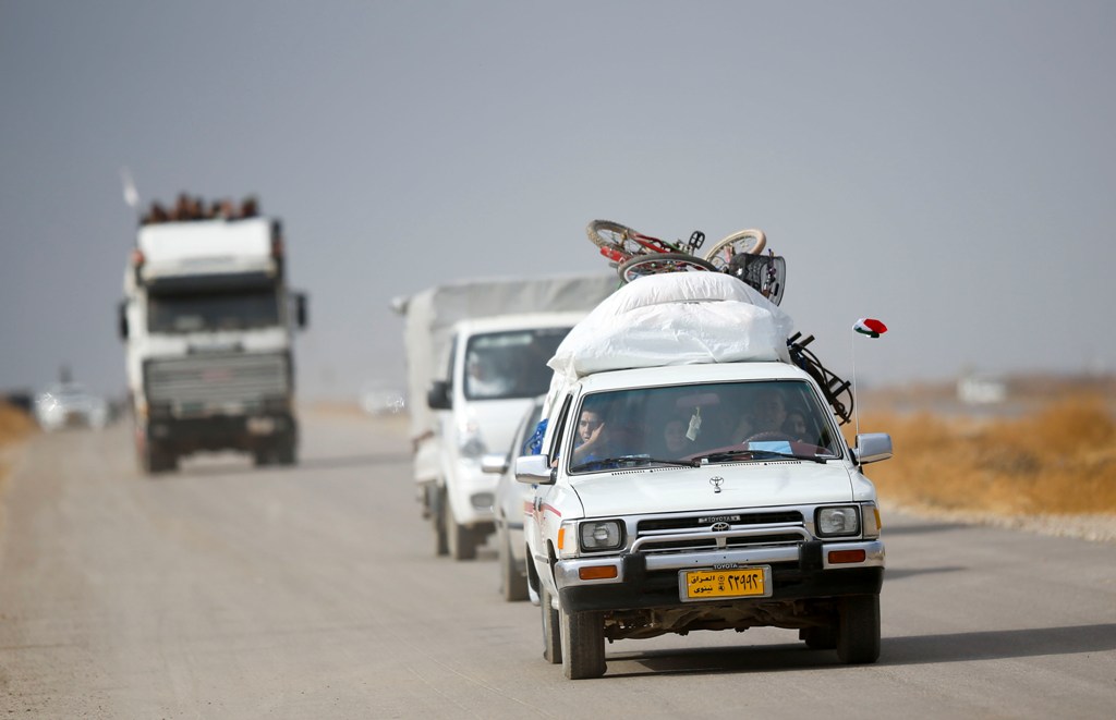 NINEVEH, IRAQ - NOVEMBER 8: Internally relocated people fleeing from the villages and neighborhoods from eastern Mosul arrive at the check point at the Bartella front in Nineveh, Iraq on November 8, 2016 as the operation to liberate Mosul from IS continue