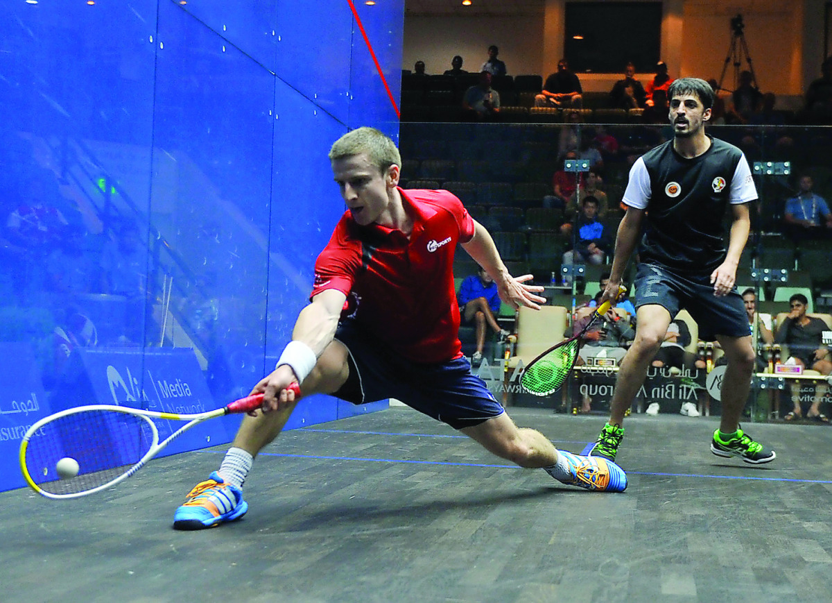 Alan Clyne (left) from Scotland in action against Farhan Zaman of Pakistan in the qualifying rounds of the Qatar Classic 2016 at the Khalifa International Squash Complex in Dohe yesterday. Picture by: Kammutty VP/The Peninsula