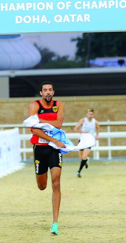 German modern pentathlete Patrick Dogue crosses the finish line to win the 2016 Champion of Champions event at Al Shaqab Arena yesterday. Picture by: Salim Matramkot/The Peninsula
