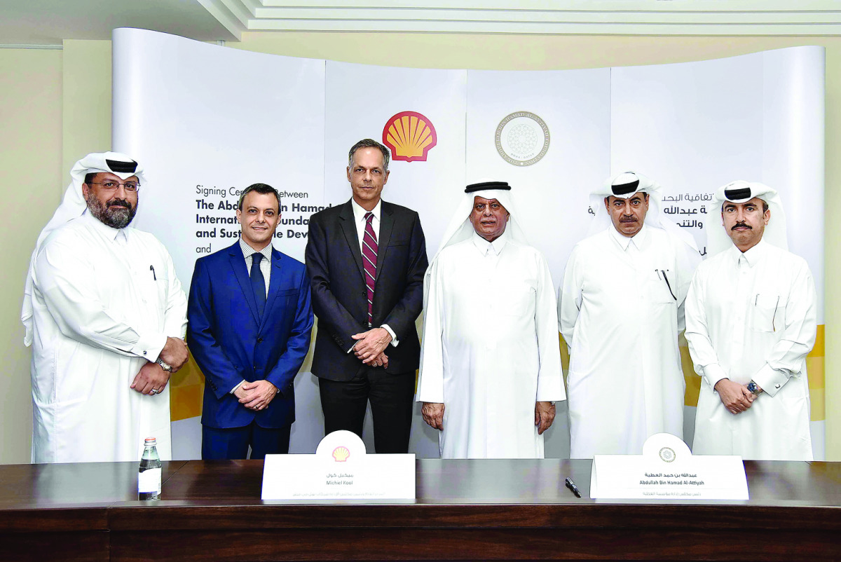 Abdullah bin Hamad Al Attiyah (third right), Chairman of Al Attiyah Foundation, and other officials at the signing ceremony. 