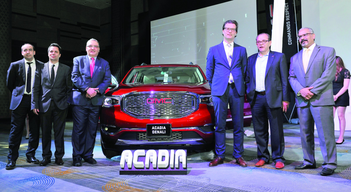 Mahmoud Skhiri (third left), General Manager- Sales at Mannai Trading Co; Markus Leithe, (third right) Managing Director, Middle East Commercial Operations at General Motors; and other officials during the launch of the All New GMC Acadia at Westin Hotel 