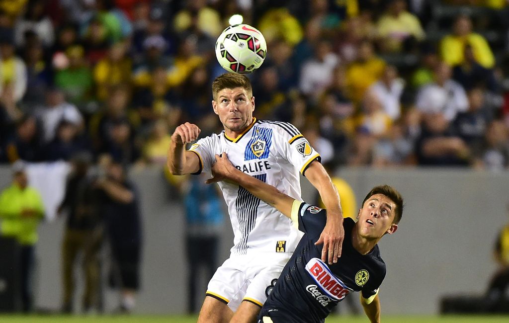 (FILES) This file photo taken on July 11, 2015 shows Steven Gerrard (L) of the LA Galaxy as he vies for the header with Jose Daniel Guerrero (R) of Club America in the ex-Liverpool and England international's debut for the MLS team during their 2015 Inter
