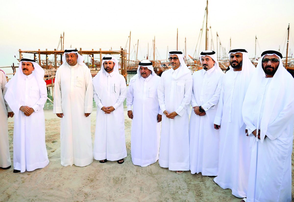 Minister of Culture and Sports H E Salah bin Ghanem Ali Ali (fourth right), Sheikh Faisal bin Qassim Al Thani (fourth left), Katara General Manager Dr Khalid bin Ibrahim Al Sulaiti (third left) and other guests at the opening of Katara 6th Traditional Dho