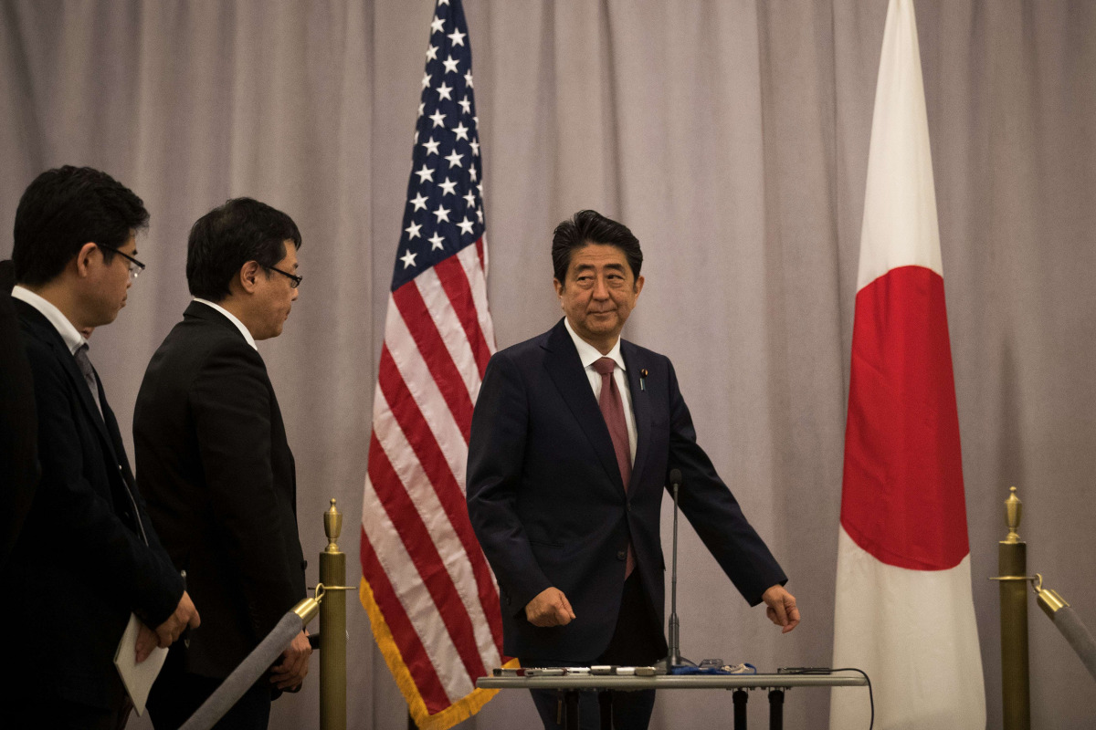  Prime Minister of Japan Shinzo Abe arrives to speak to reporters following a meeting with President-elect Donald Trump November 17, 2016 in New York City. Trump and his transition team are in the process of filling cabinet and other high level positions 