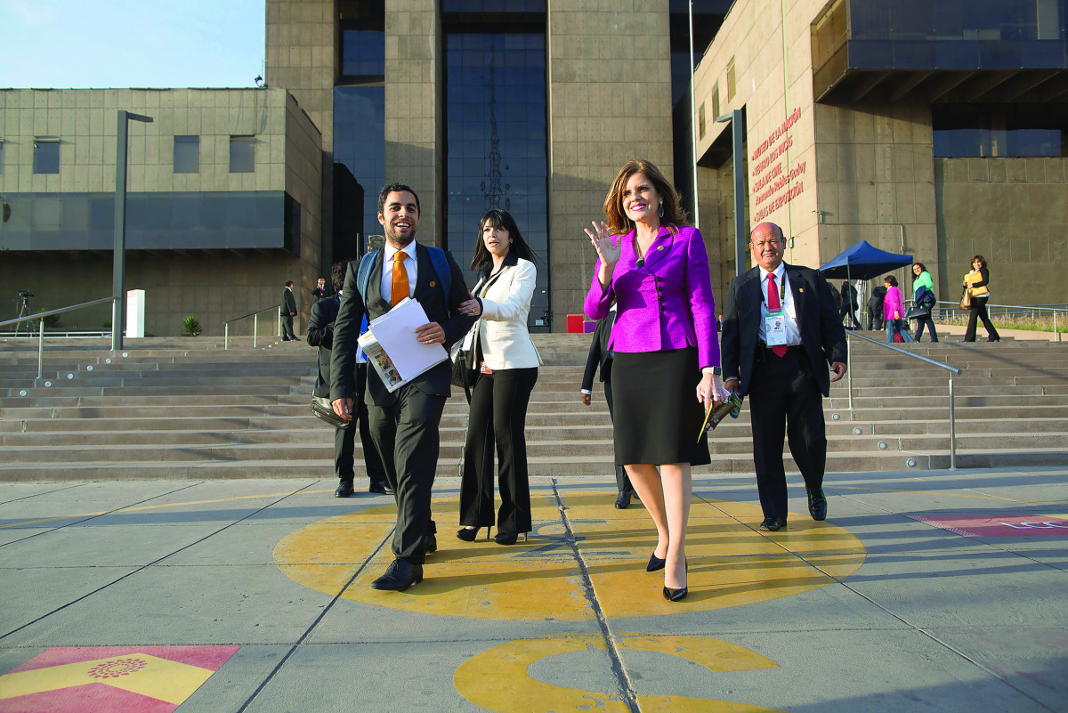 Peru's Second Vice-President Mercedes Araoz (right) arrives the Lima Convention Center during the Asia-Pacific Economic Cooperation (APEC) Summit in Lima, Peru, yesterday.