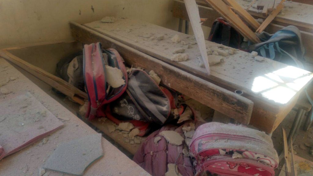 Students' bags are seen amid the debris of a damaged classroom after shelling by Syrian rebels on government-held western Aleppo, Syria in this handout picture provided by SANA on November 20, 2016. SANA/Handout via REUTERS