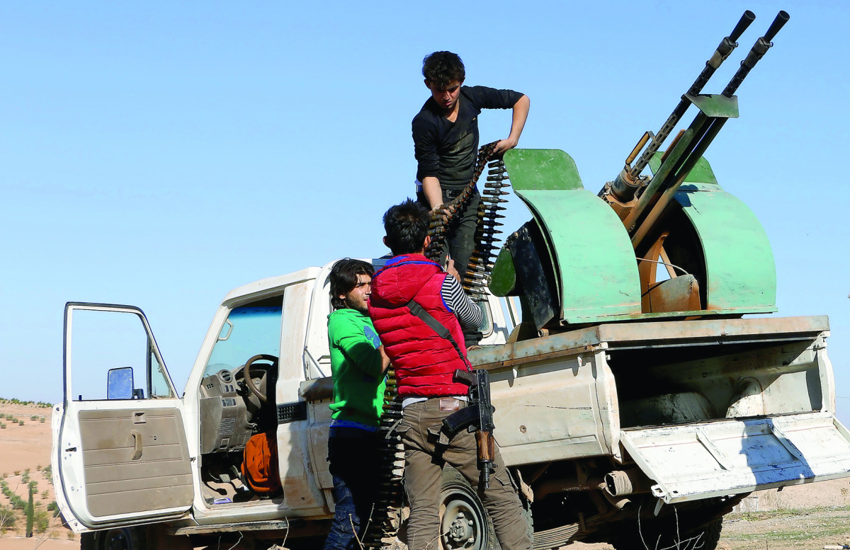 Free Syrian Army (FSA) members make preparations before they attack Daesh terrorists' positions at Kabasin neighborhood in Aleppo, Syria, yesterday.