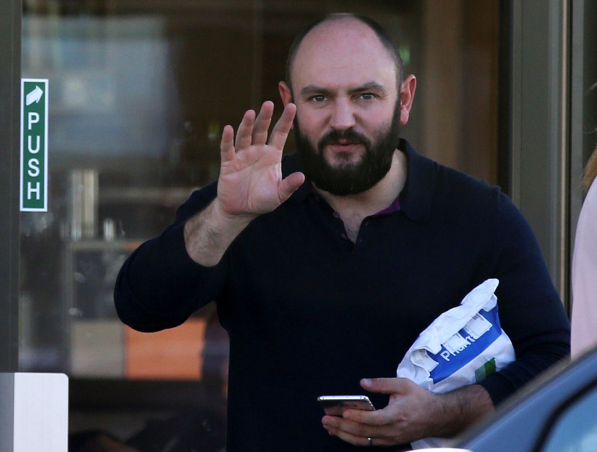 Simon Dowson is pictured gesturing as he walks to his car in Consett, Britain, September 30, 2016. REUTERS/Scott Heppell