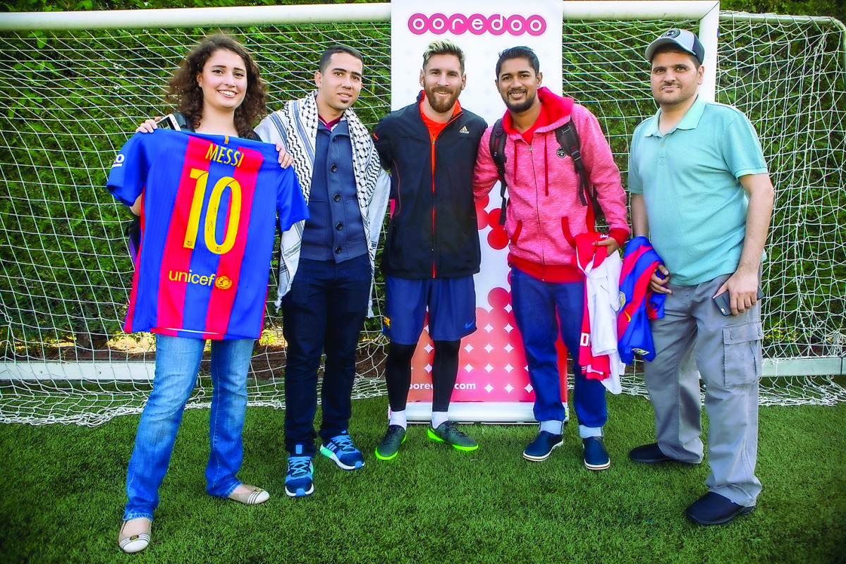 The winners with sporting hero and Ooredoo brand ambassador Leo Messi in Barcelona.