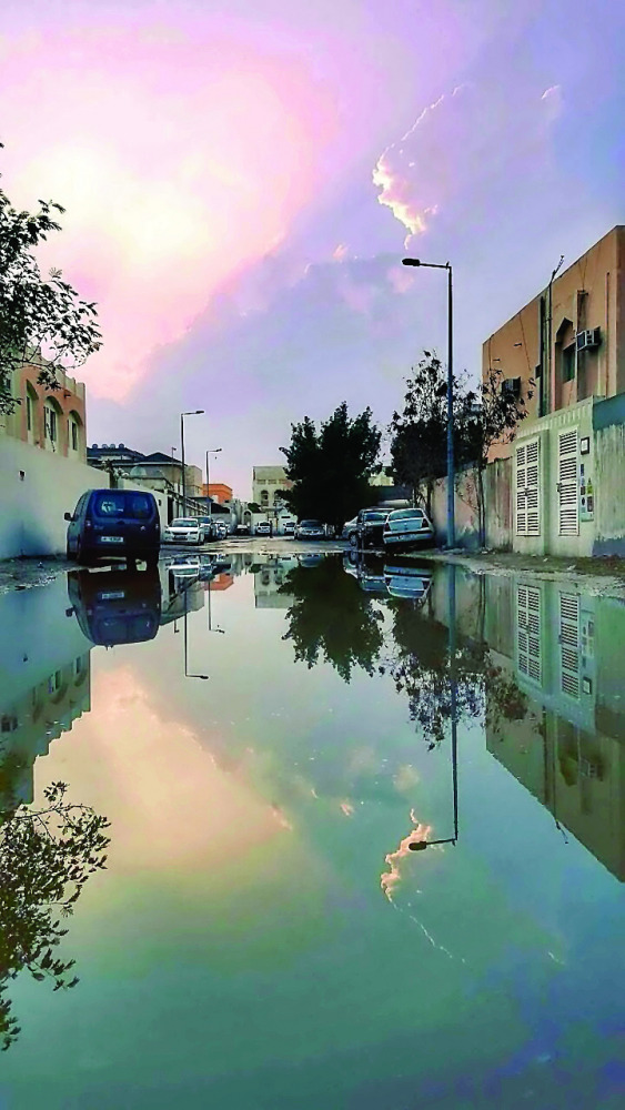 A waterlogged street in the Old Airport area after a light shower in Doha yesterday. Pic: Abdul Basit/ The Peninsula