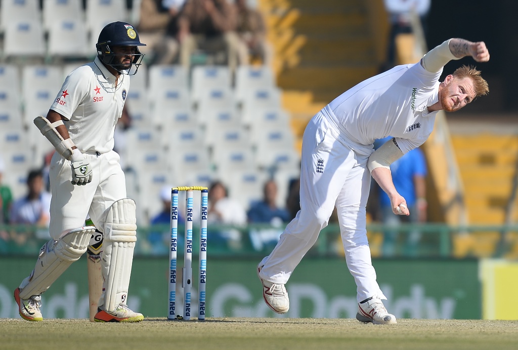England bowler Ben Stokes (R) bowls as Indian batsman Parthiv Patel looks on during second day of the third Test cricket match between India and England at The Punjab Cricket Association Stadium in Mohali on November 27, 2016. GETTYOUT / AFP / SAJJAD HUSS