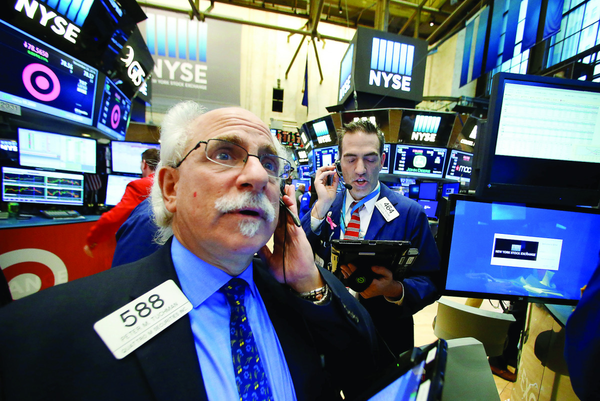 Traders work on the floor of the New York Stock Exchange.