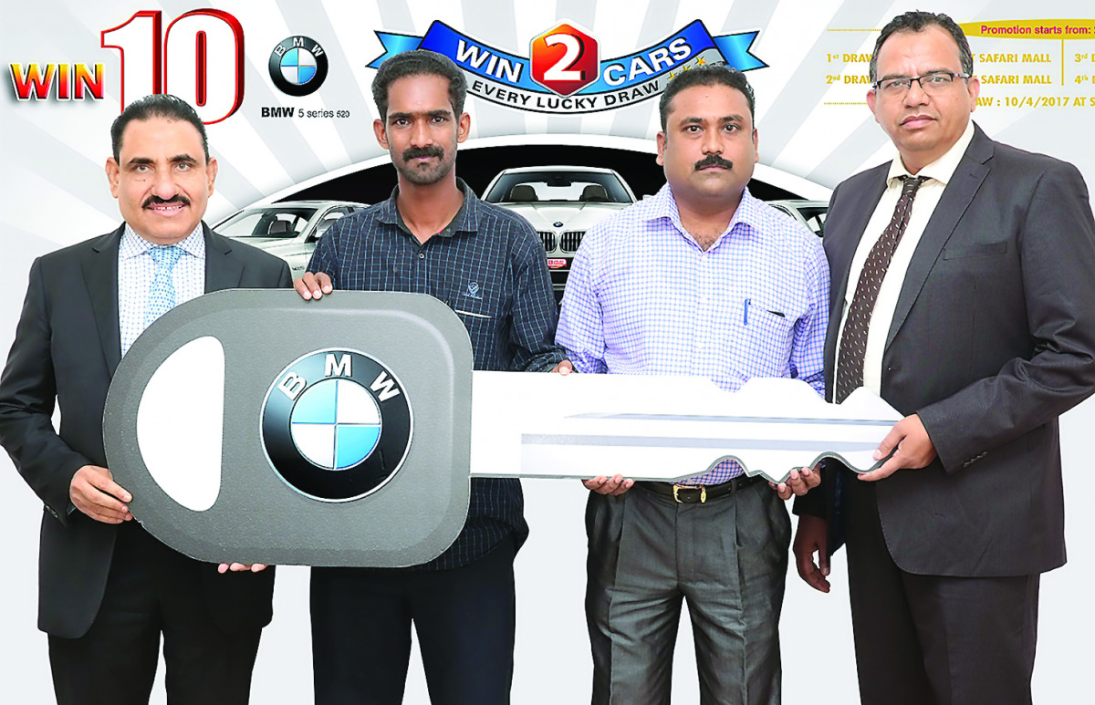Lucky Draw winners Udayakumar Golpala Pillai (Coupon No: 0125724) and Pradeep (Coupon No: 1293391) receive car key from Safari Group Director and General Manager Zainul Abideen & Operations Manager Shahid Khan.  The Second Lucky Draw for next 2 BMW cars w