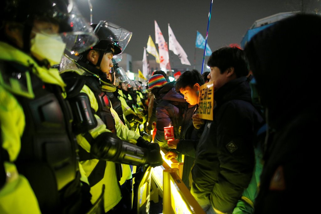 People attend a protest calling for Park Geun-hye to step down on a road leading to the Presidential Blue House in Central Seoul, South Korea, November 26, 2016. REUTERS/Kim Hong-Ji
