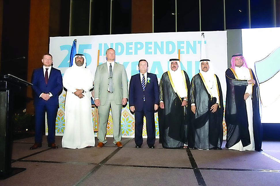 Minister of Transport and Communications H E Jassim Saif Ahmed Al Sulaiti (third right) and Yevhen Mykytenko (centre) Ambassador of Ukraine to Qatar with other officials at the event.