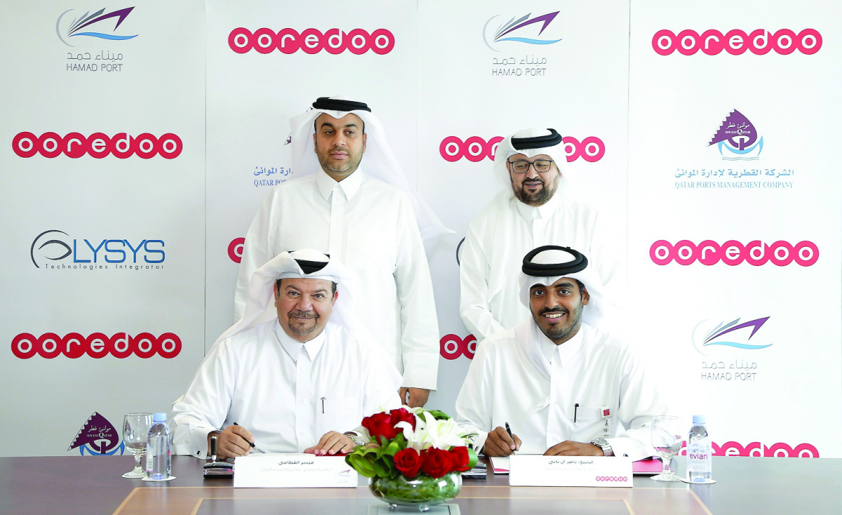 Sheikh Nasser Bin Hamad Bin Nasser Al-Thani (standing left) and Waleed Al Sayed (standing right) at the signing ceremony, yesterday.