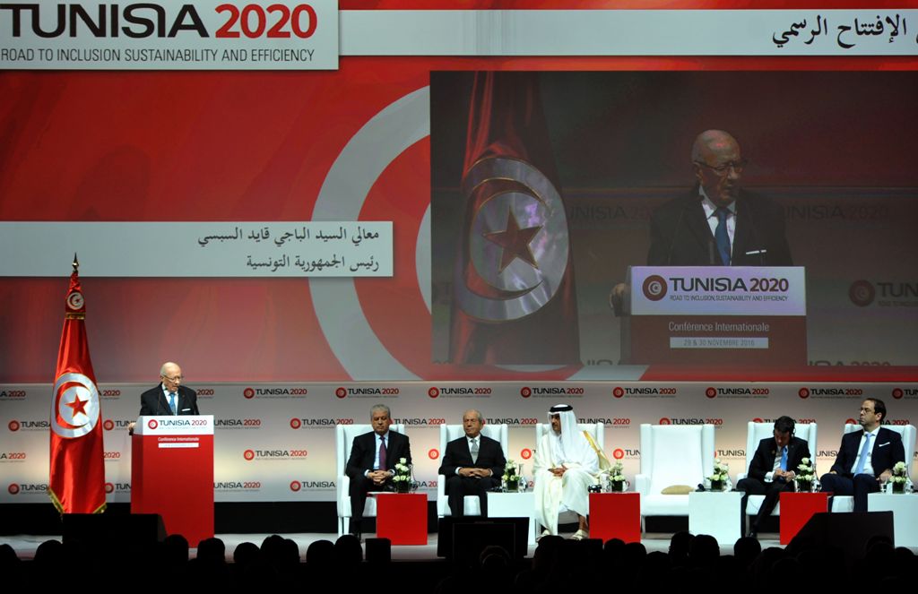 Tunisian President Beji Caid Essebsi (L) gives a speech during the opening ceremony of the 