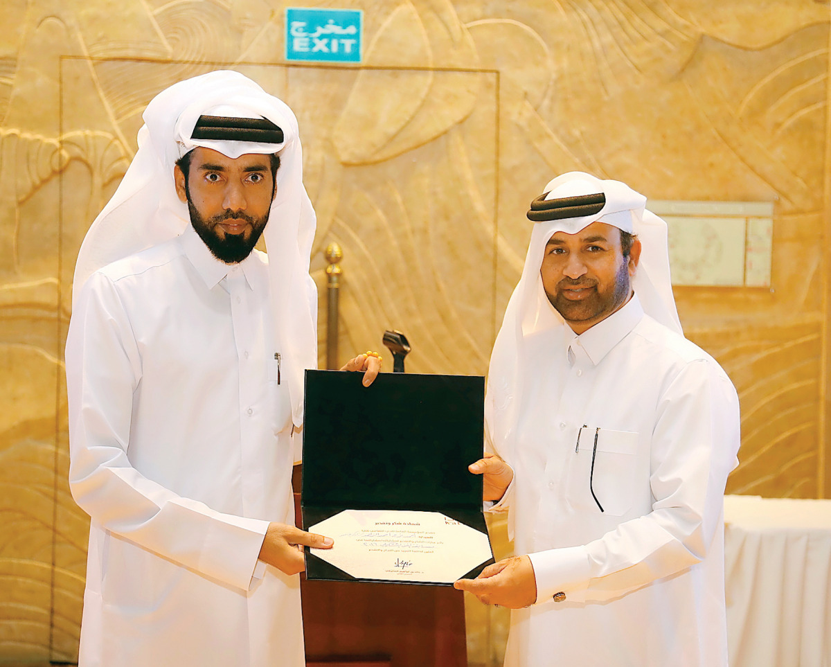 Katara General Manager Dr Khalid bin Ibrahim Al Sulaiti (right) giving prize to one of the winners.