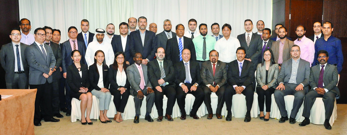 The trainers and participants  at the  training programme  in Doha 