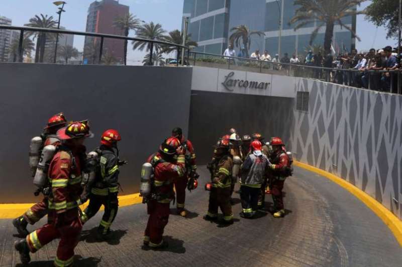 File photo of firefighters at the Larcomar Mall in Peru. Reuters 