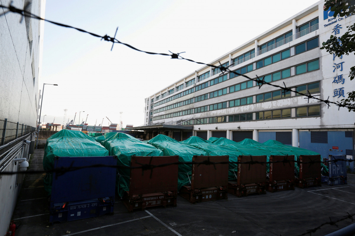 Armored troop carriers, belonging to Singapore, are detained at a cargo terminal in Hong Kong, China November 28, 2016. REUTERS/Bobby Yip