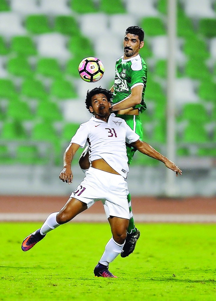 El Jaish's Romarinho (front) vies for the ball with Al Ahli player during their Qatar Stars League match at Al Ahli Stadium, yesterday. Pictures by Kammutty VP/  The Peninsula 