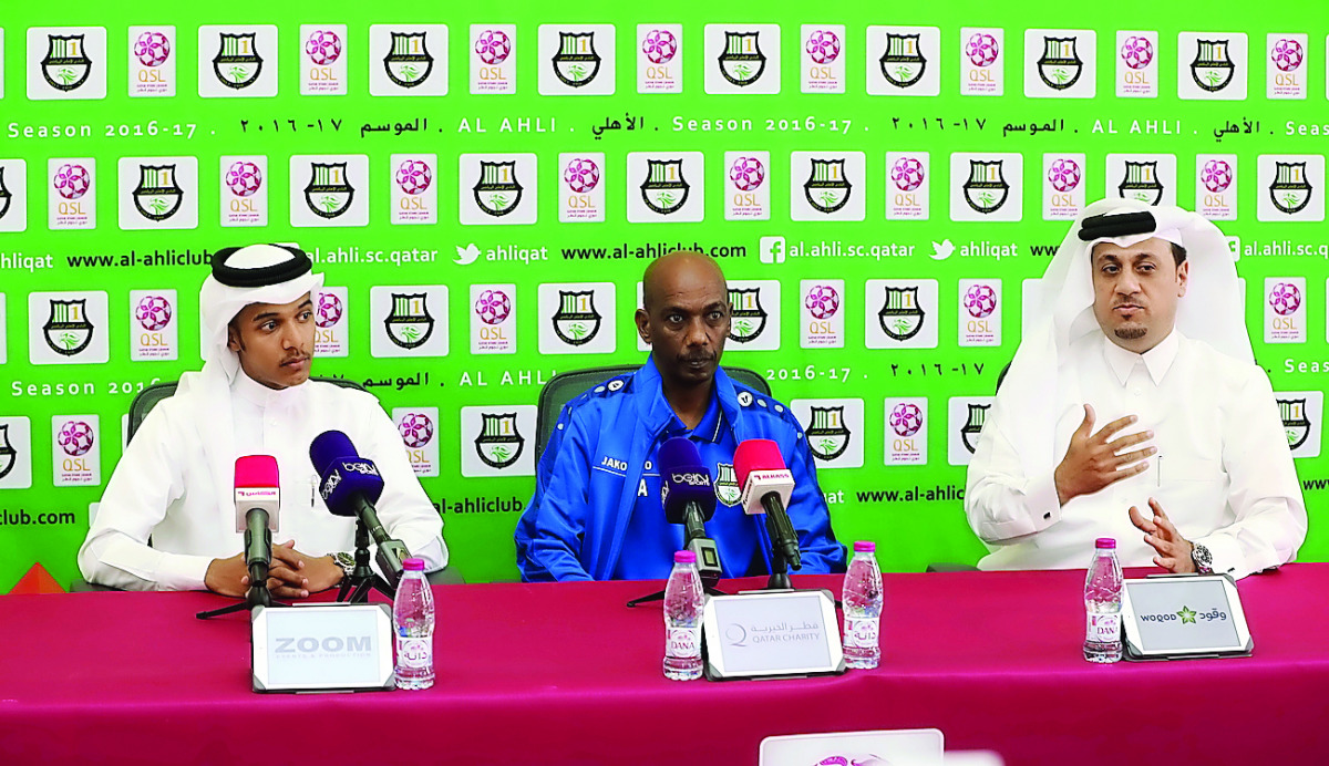 Al Ahli manager Yusef Adam (centre) 

