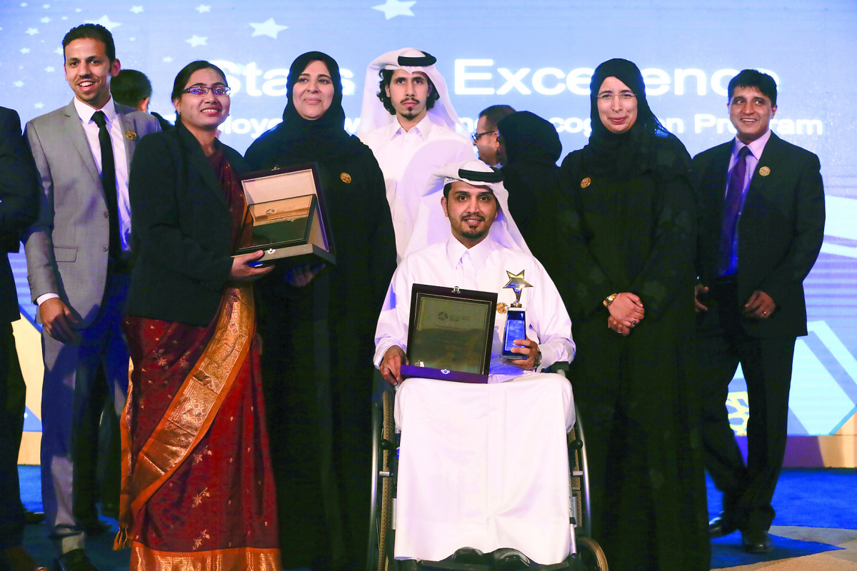 Minister of Public Health and Managing Director of HMC, H E Dr Hanan Mohamed Al Kuwari, and members of some of the winning teams at the 2016 HMC Stars of Excellence Awards.