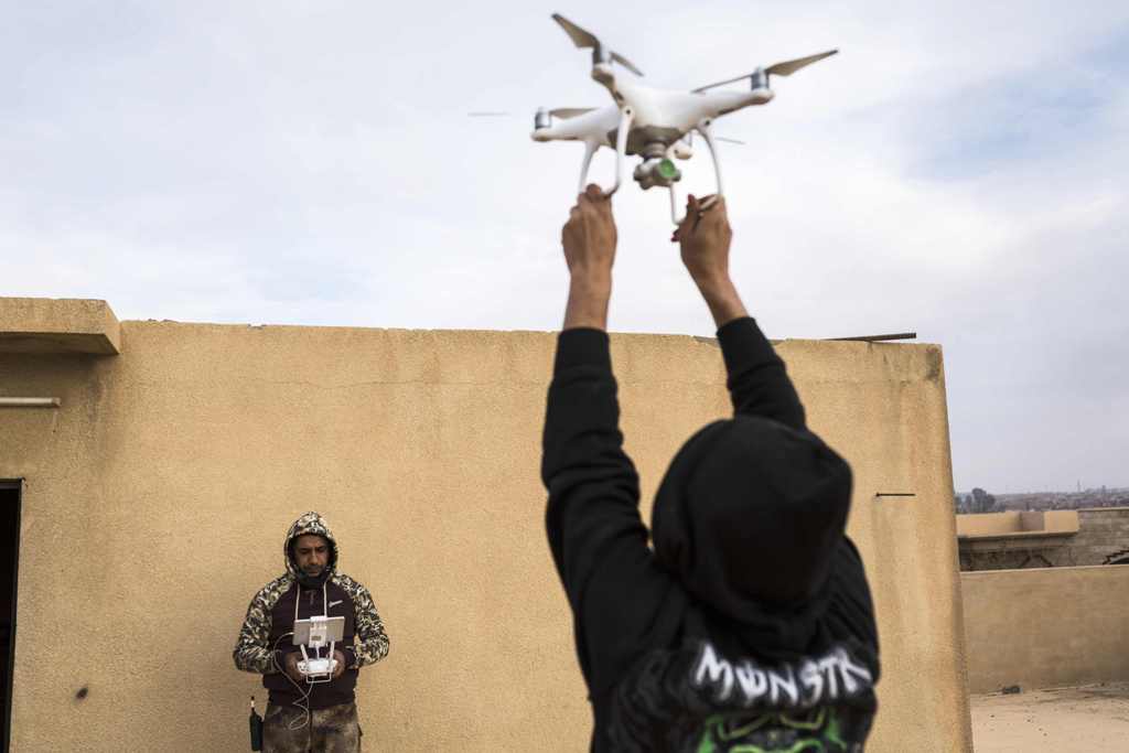 A drone operator from the Mosul Brigade of the Iraqi Special Operations Force 2 (ISOF 2) releases a drone to the air during a military operation to retake parts of the al-Tamim area of Mosul from jihadists of the Islamic State (IS) group on November 5, 20