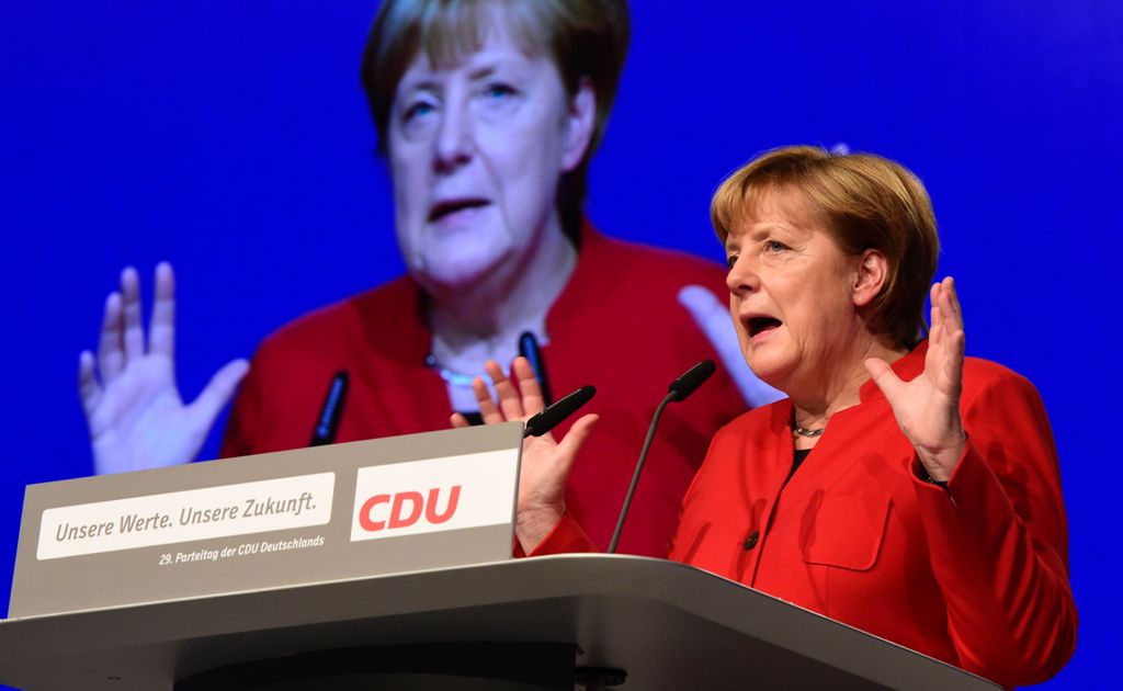 German Chancellor Angela Merkel addresses delegates during her conservative Christian Democratic Union (CDU) party's congress in Essen, western Germany, on December 6, 2016.  AFP / TOBIAS SCHWARZ