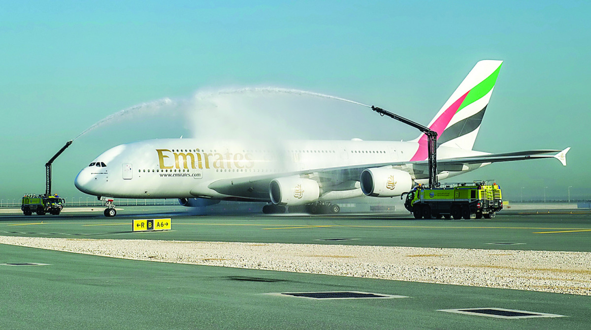 The Emirates A380 is greeted by a water cannon salute at Hamad International Airport in Doha.