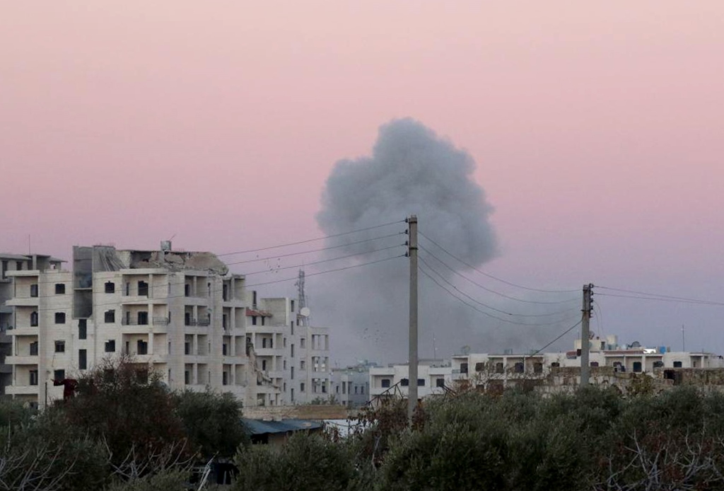 Smoke rises after war crafts belonging to the Assad Regime forces carried out airstrike over residential areas at Maarrat Misrin town of Idlib, Syria on December 6, 2016. (Bahjat Najar / Anadolu Agency)