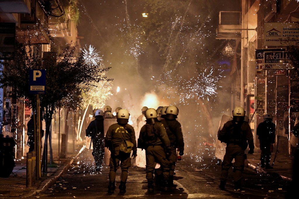 Fireworks explode next to riot police during clashes following an anniversary rally marking the 2008 police shooting of 15-year-old student, Alexandros Grigoropoulos, in Athens, Greece, December 6, 2016. REUTERS/Alkis Konstantinidis TPX IMAGES OF THE DAY