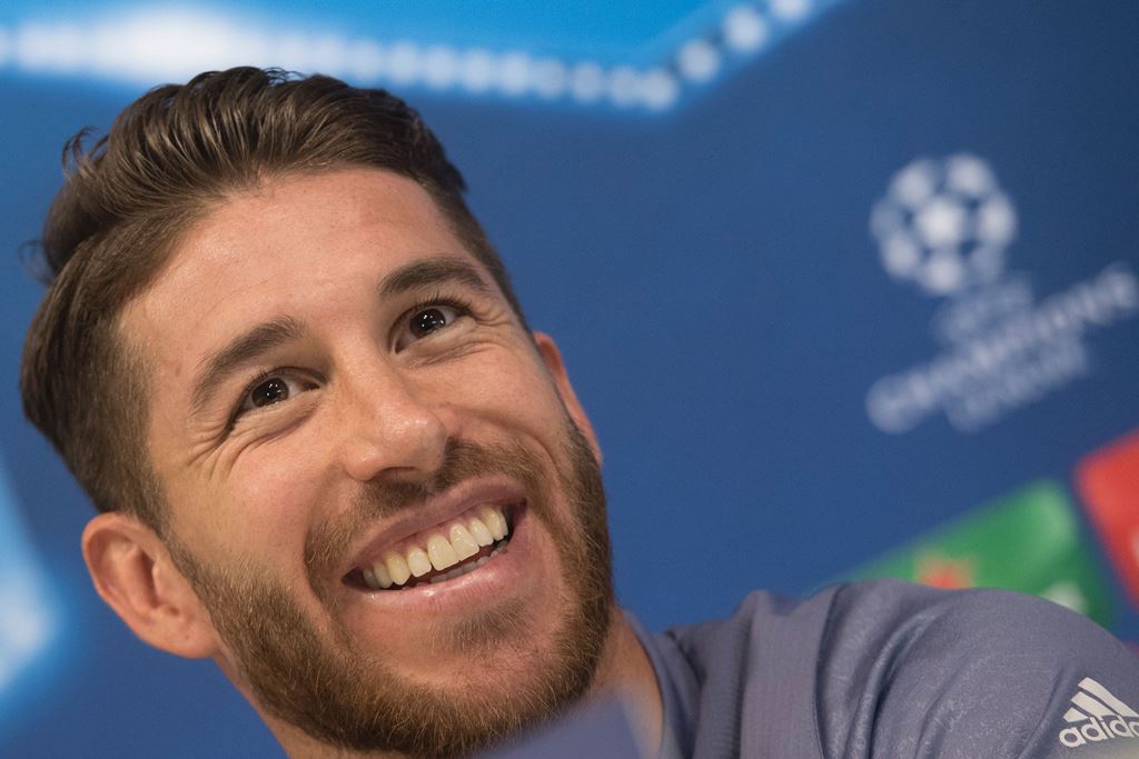 Real Madrid's defender Sergio Ramos smiles as he gives a press conference on the eve of the UEFA Champions league football match Real Madrid vs Borussia Dortmund at the Real Madrid's training ground of Valdebebas in Madrid on December 6, 2016. AFP / CURTO