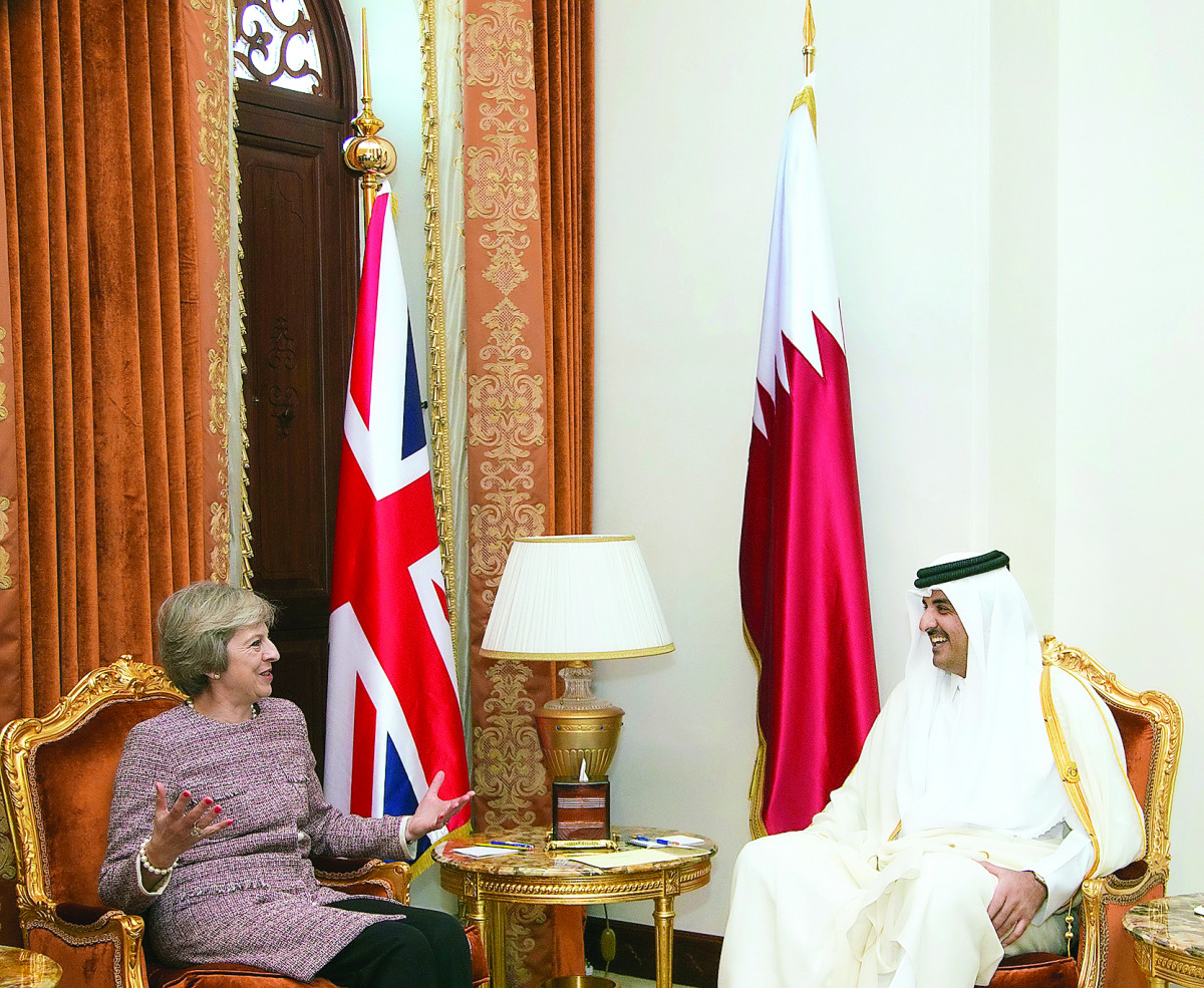 Emir H H Sheikh Tamim bin Hamad Al Thani with British Prime Minister Theresa May, in Manama, Bahrain, yesterday.
