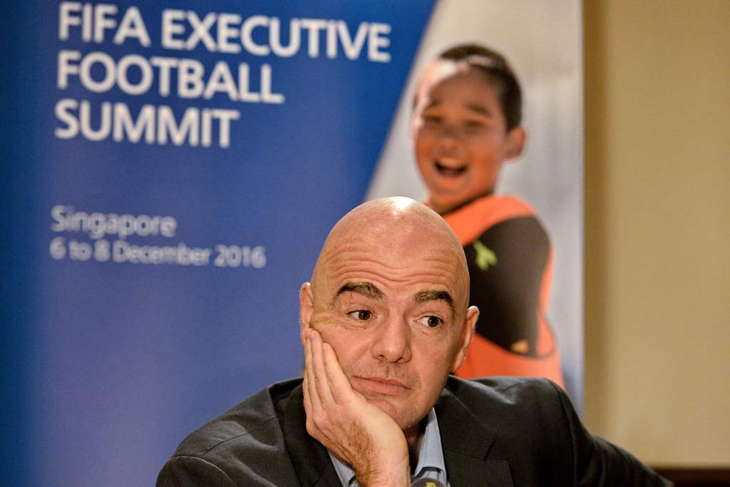 FIFA President Gianni Infantino attends a media briefing after the Fifa Executive Football Summit in Singapore on December 8, 2016. AFP / Roslan RAHMAN
