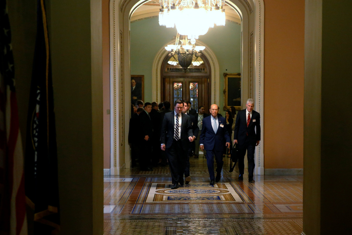 Wilbur Ross (2nd R), U.S. President-elect Donald Trump's nominee to be Commerce Secretary, arrives to meet with Senate Majority Leader Mitch McConnell (not pictured) in his office at the U.S. Capitol in Washington, U.S. December 6, 2016. REUTERS/Jonathan 