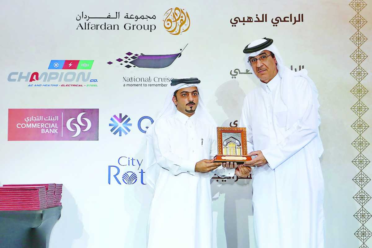 Officials of the Commercial Bank receiving the honour.