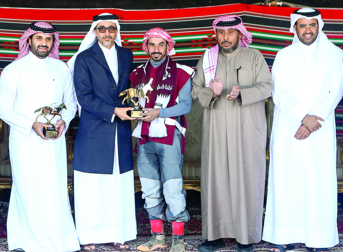The winner of the 120km CEI** event, Hamad Towaim Al Marri receives the trophy from Minister of Culture and Sports H E Salah bin Ghanem Al Ali.
