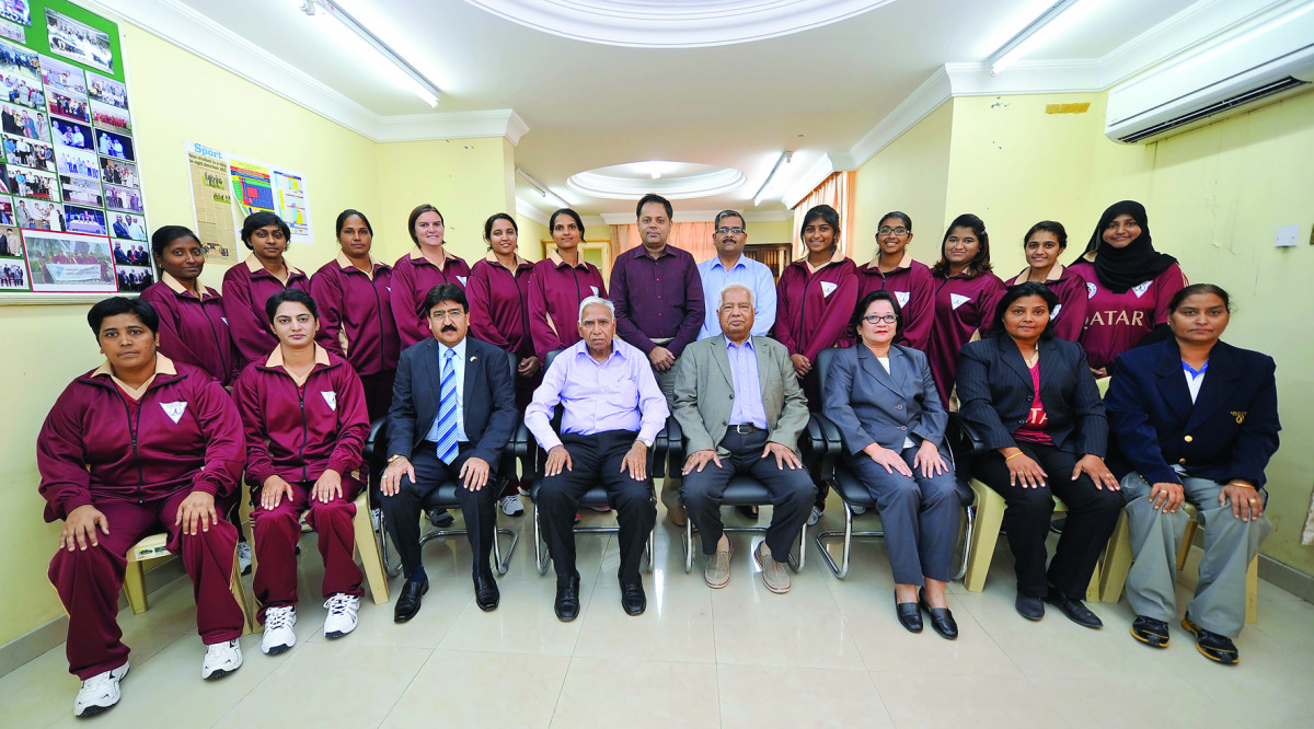 The Qatar Women's cricket team poses for a photograph with Qatar Cricket Association officials prior to their departure to UAE. 