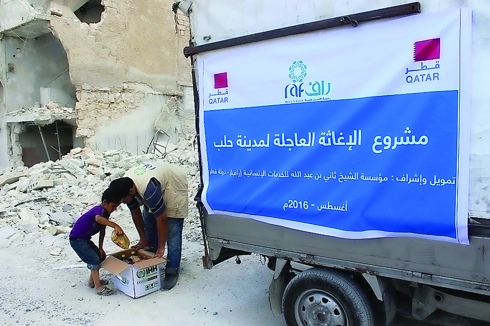 An RAF volunteer distributing aid in Aleppo.