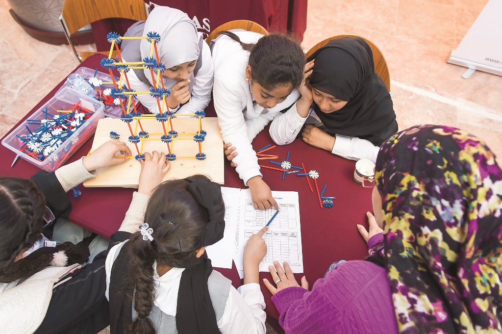 File photo of school students learning about experience-based science and engineering challenges at the Young Engineers and Scientists programme.
