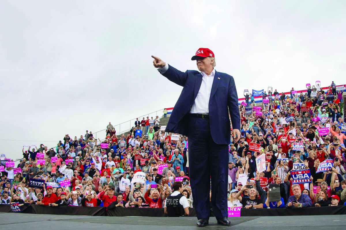 Supporters cheers as US President-elect Donald Trump arrives to speak in Mobile, Alabama, during a ‘Thank You Tour 2016’ rally, yesterday.
