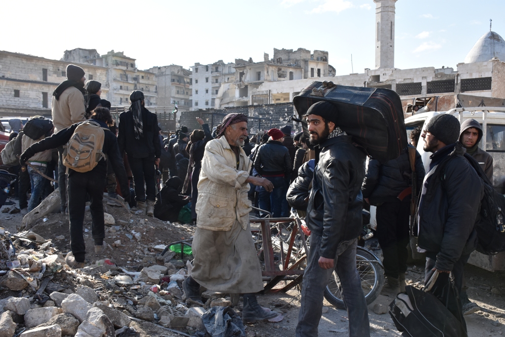 ALEPPO, SYRIA - DECEMBER 20: Civilians from East Aleppo, which was under siege by Assad regime forces and its supporter foreign terrorist groups, wait for their evacuation at Amerriye region of Aleppo, Syria on December 20, 2016. ( Mustafa Sultan - Anadol