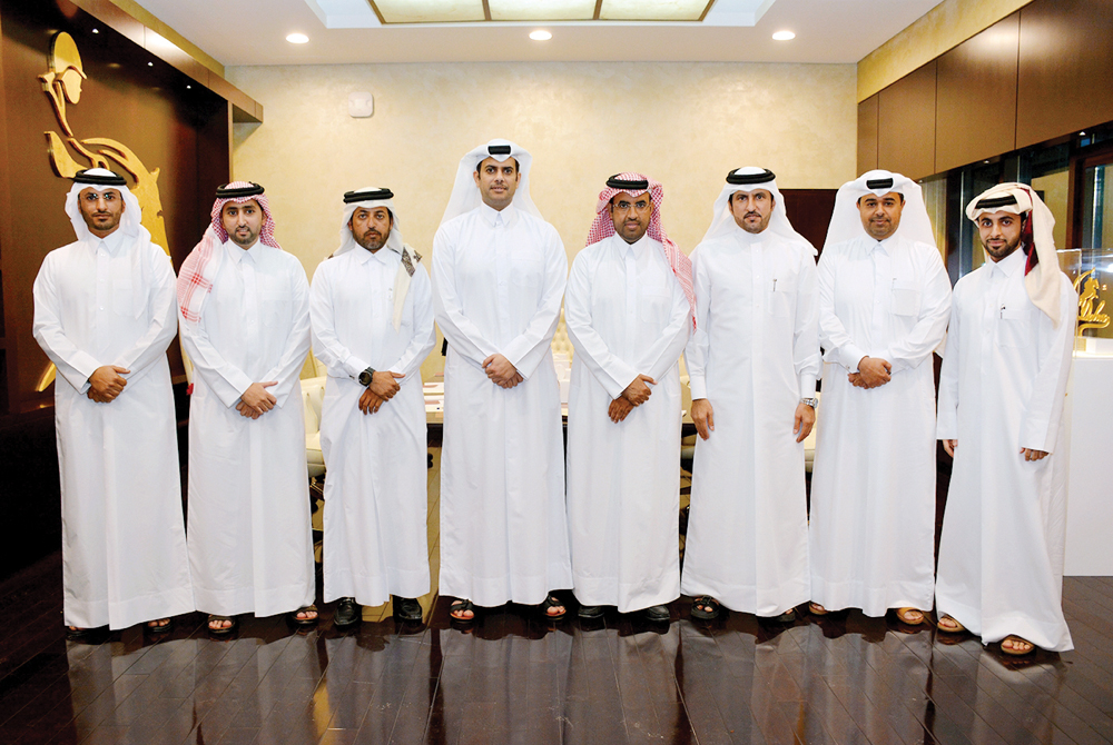 Hamad bin Abdulrahman Al Attiyah (fourth right), the President of QEF board poses for a photo with the new board members during the annual QEF meeting held in Doha, yesterday. 