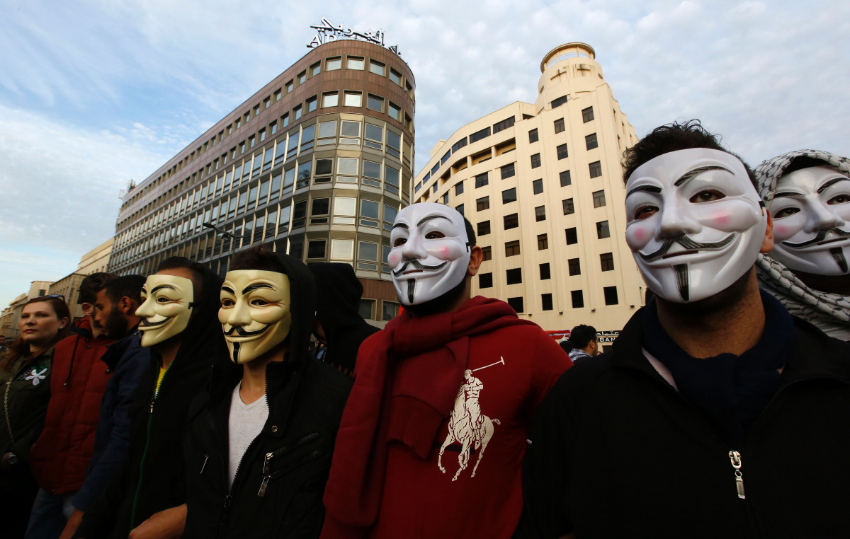 FILE PHOTO: Masked Lebanese protesters taking part in a demonstration against the on-going trash crisis and government corruption in downtown Beirut on March 12, 2016. (AFP / ANWAR AMRO) 