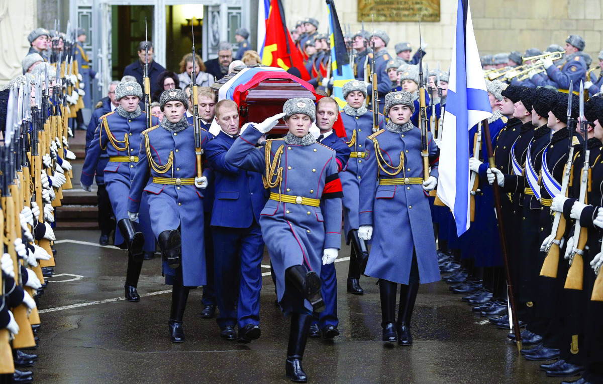 The casket of slain Russian ambassador to Turkey, Andrei Karlov, is carried out of the Russian Foreign Ministry in Moscow after a memorial service, yesterday.