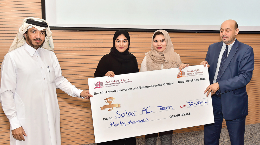Some winners of the innovation contest receiving the prize money.