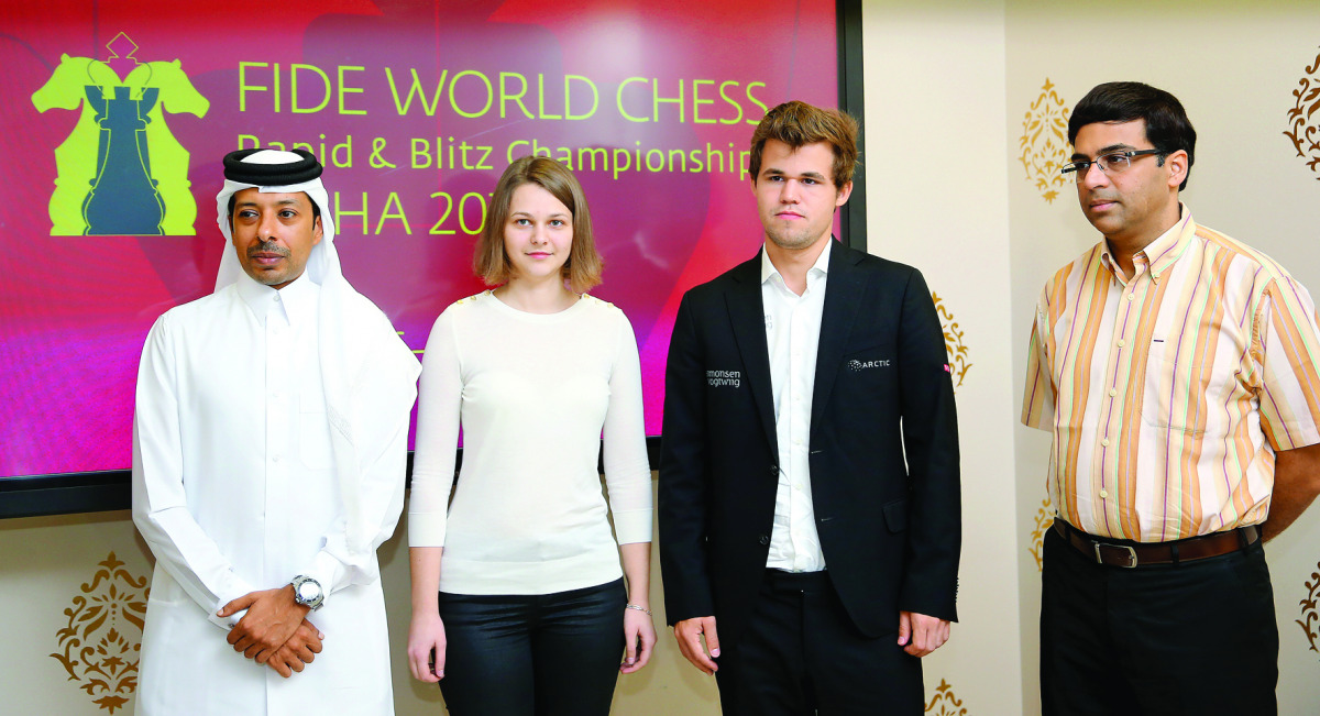 Qatar Chess Association General Secretary Mohammed Al Medaikhi, Slovenian Grandmaster Anna Muzychuk, World Chess Champion Magnus Carlsen and Former world champion Viswanathan Anand pose for a photograph during a press conference in Doha yesterday.