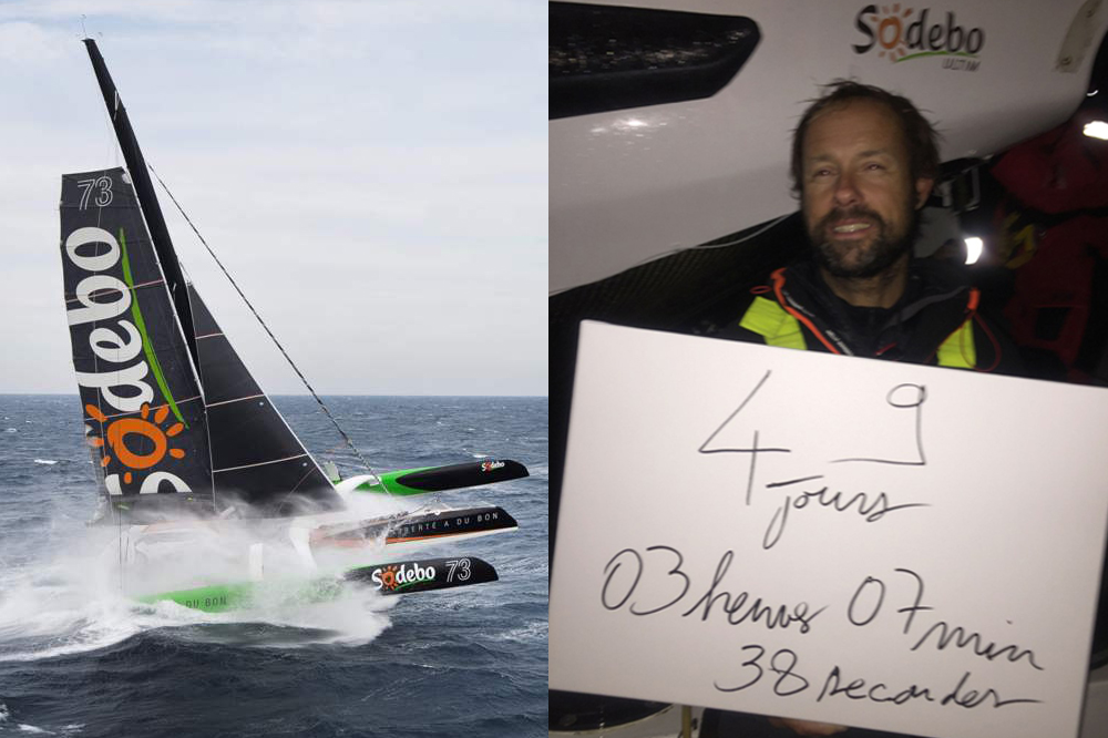 A handout picture released by Sodebo sailing team on December 25, 2016 shows French skipper Thomas Coville holding a poster reading 